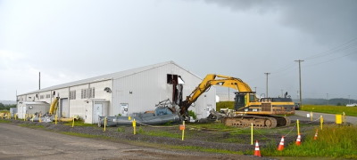 Demolition begins on Building K-2500-H. The facility was located near the massive K-25 gaseous diffusion building and supported demolition efforts for that project.. Image: govdelivery.com